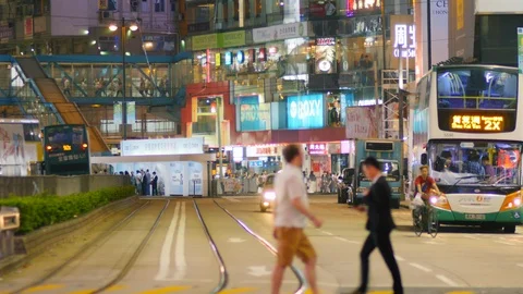 Anonymous commuters crowd crossing street at night Hong Kong. 스톡 동영상 110545106