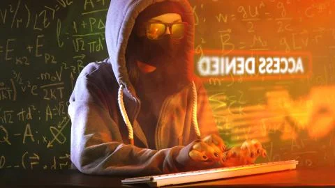 Anonymous computer hacker with mathematical formulas on background.  Stock-Fotos