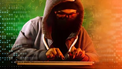 Anonymous computer hacker with mathematical formulas on background.  Stock-Fotos