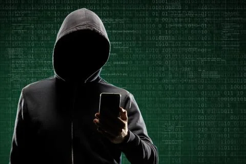 Anonymous computer hacker with a smartphone over abstract digital background Stock-Fotos