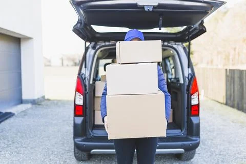 Anonymous courier with plenty boxes Resolution and high quality beautiful photo Stock Photos