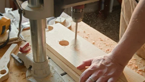 Anonymous Craftsman Drilling Hole in Plank with Press Machine during Workday Stock Footage 334436573