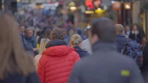 Anonymous crowd &amp; cars move down street Stock Footage 69092200