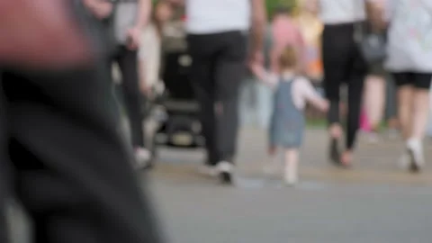 Anonymous crowd of pedestrians walking crossing street a busy city crowded Stock Footage 156544356