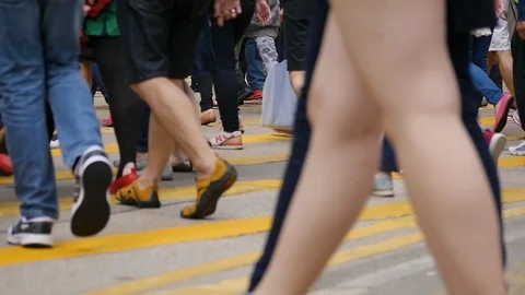 Anonymous crowd people passing crossroads slow motion. 動画素材 110525717