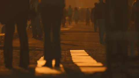 Anonymous crowd of people walking at sunset Stock Footage 330201163