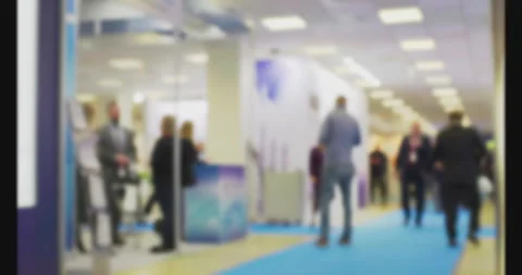 Anonymous crowd walking in a blurred convention center Stock Footage 301079930