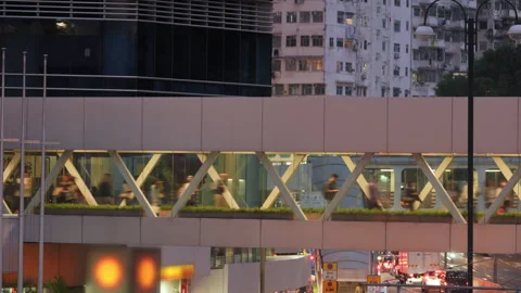 Anonymous crowd walking inside a modern elevated pedestrian bridge Stock Footage 337387986