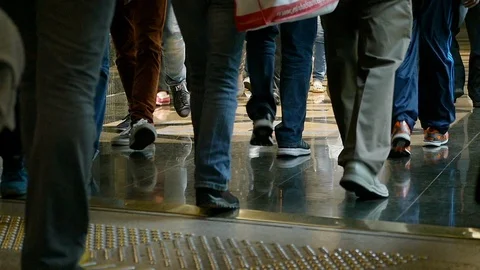 Anonymous crowd walking legs slow motion selective focus Video stock 110417981