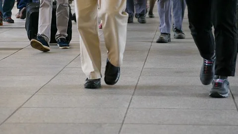 Anonymous crowd walking legs slow motion selective focus Vídeo Stock 110421099