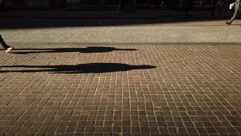 Anonymous Crowds with Long Shadows Stock Footage 120664192