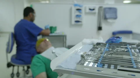 Anonymous Dentist tools patient in background Stock Footage 47676874