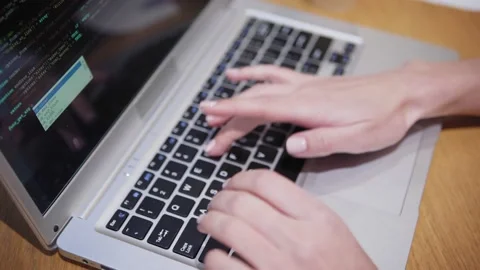 Anonymous developer creating code in office Stock Footage 142062720