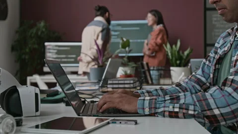 Anonymous Developer Typing Code on Laptop at Big Tech Company Stock Footage 285709162