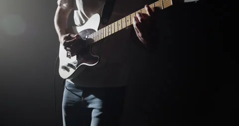 Anonymous energetic man playing guitar on stage Stock Footage 252210757