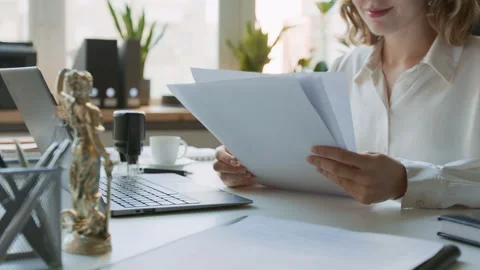 Anonymous Female Attorney Studying Documents at Law Firm Video stock 302407580