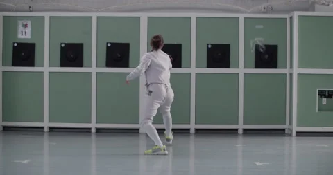 Anonymous fencer practicing in gym alone Stock Footage 224967383
