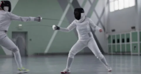 Anonymous fencer training with opponent Stock Footage 224968653