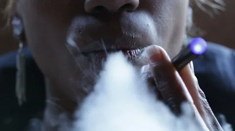 Anonymous Front Close Up Jaw African American Woman Vapes Smokes an E-Cigarette Stock Footage 48389534