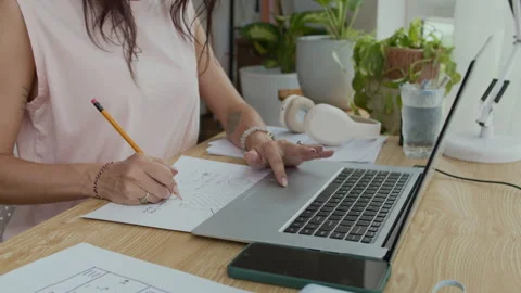 Anonymous Graphic Designer Using Paper Mockup when Testing on Laptop at Desk Stock Footage 300824606
