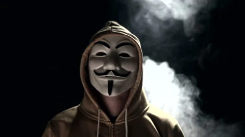Anonymous hacker activist on black background Stock Footage 68979202