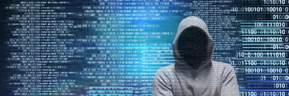 Anonymous hacker with computer code binary interface Foto stock