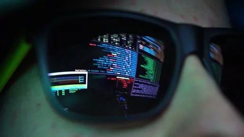Anonymous Hacker in Dark Glasses Looking at Computer Screen Code Reflections Stock Footage 106401775