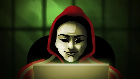 Anonymous hacker in a hoodie using a computer Stock Footage 342367439