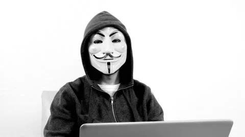 Anonymous hacker with mask talking to camera 4k Stock Footage 63169578