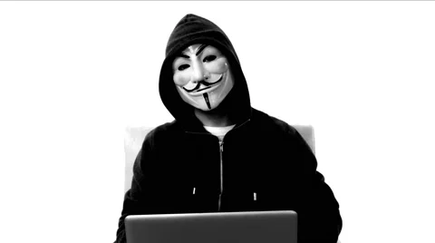 Anonymous hacker with mask talking to camera 4k Stock Footage 63169935