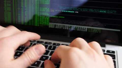 Anonymous Hacker Programming in Computer Console Breaking Password Video stock 106398899
