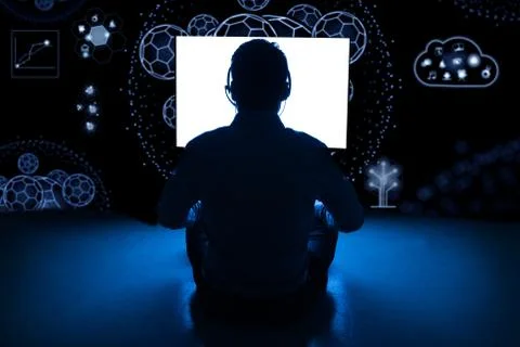 Anonymous hacker silhouette using computer 写真素材