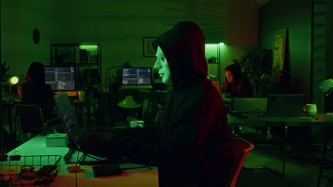 Anonymous Hacker Using Laptop for Carrying out Cyber Attack Late at Night Stock Footage 299276690