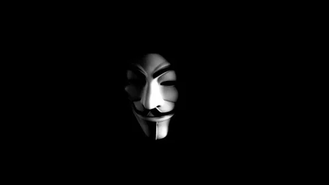 Anonymous hacker wearing mask and hoodie  cyber crime Stock Footage 276607202