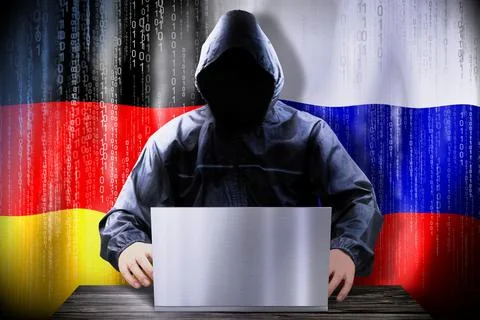 Anonymous hacker working on a laptop, flags of Germany and Russia Stock-Illustration