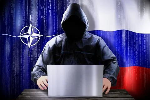 Anonymous hacker working on a laptop, flags of NATO and Russia Stock-Illustration