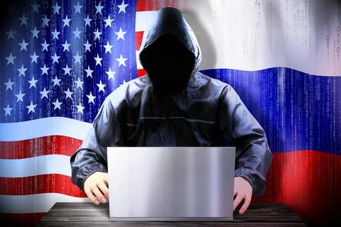 Anonymous hacker working on a laptop, flags of USA and Russia Stock-Illustration