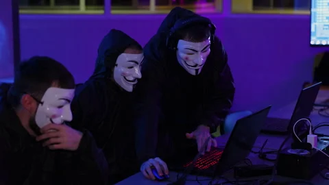 Anonymous Hackers Engaging in Action Utilizing Advanced HighTech Equipment and Stock Footage 297489069