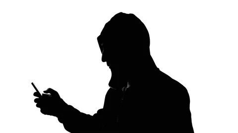 Anonymous hacking with smartphone 4k Stock Footage 63169955