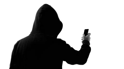 Anonymous hacking with smartphone 4k Stock Footage 63169974