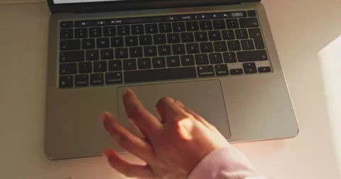 Anonymous Hand Scrolling on Laptop - Modern Technology and Digital Navigation Stock Footage 319067702