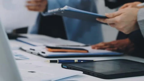 Anonymous hands of an accountant working with documents Stock Footage 333274867