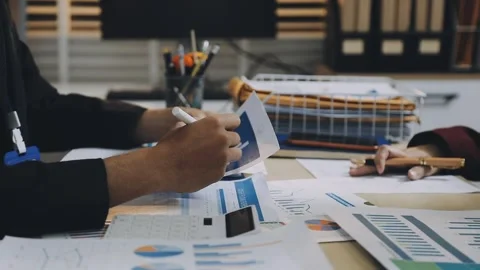 Anonymous hands of an accountant working with documents Stock Footage 333274902