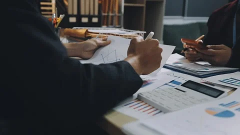 Anonymous hands of an accountant working with documents Stock Footage 333274905