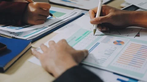 Anonymous hands of an accountant working with documents Stock Footage 333274924