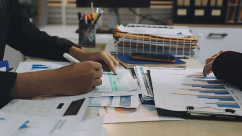 Anonymous hands of an accountant working with documents Stock Footage 333274927