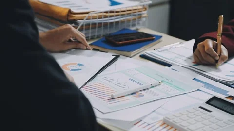 Anonymous hands of an accountant working with documents Stock Footage 333274928