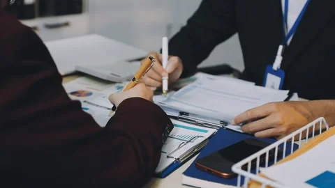 Anonymous hands of an accountant working with documents Stock Footage 333274942