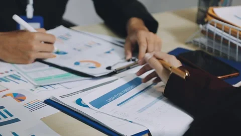Anonymous hands of an accountant working with documents Stock Footage 333274943