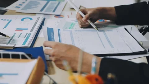 Anonymous hands of an accountant working with documents Stock Footage 333274945